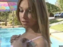 Here is a sexy latina whore by the pool masturbating